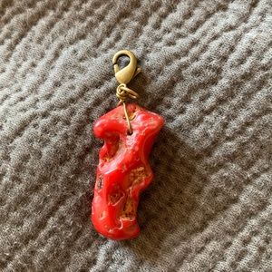 Red and gold pendant.